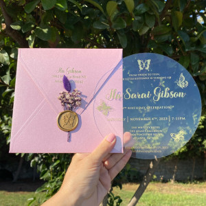 Gold foil printed acrylic birthday invitation, Butterfly themed Quinceañera invitation, Pink pearl envelope, Gold wax seal and purple flowers.