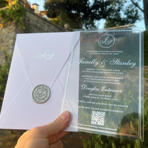 Clear Acrylic wedding invitation. White envelope. Silver foil print. Silver wax seal 